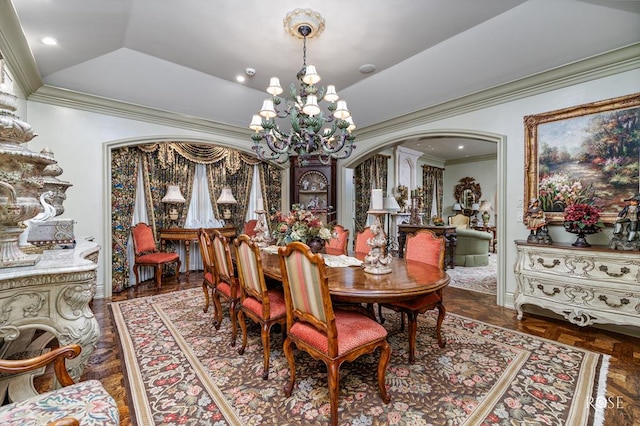 dining room featuring ornamental molding, lofted ceiling, a notable chandelier, and dark parquet floors