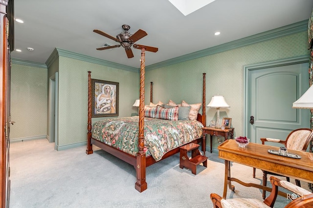 bedroom featuring ornamental molding, light carpet, ceiling fan, and a skylight