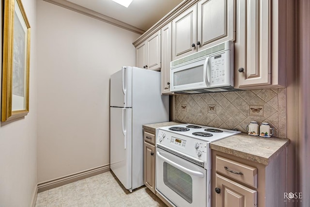 kitchen with crown molding, white appliances, and decorative backsplash