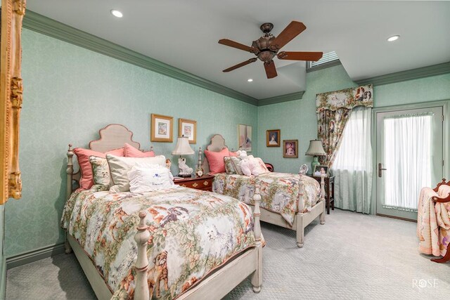 bedroom with ornamental molding, carpet, and ceiling fan