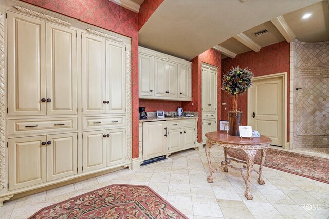 kitchen featuring crown molding and beamed ceiling