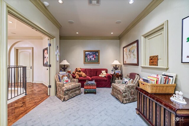 living room featuring crown molding and light parquet floors