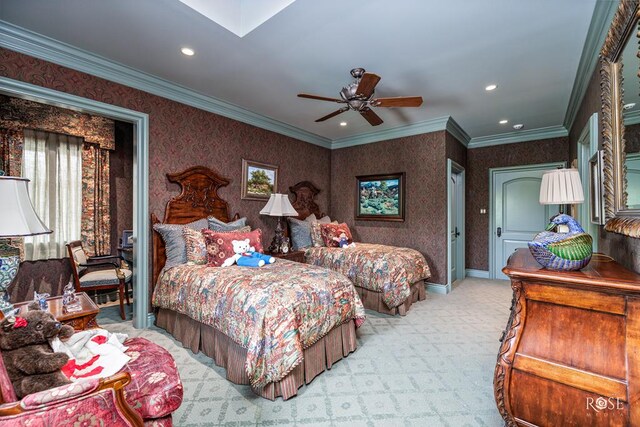 carpeted bedroom featuring ceiling fan and ornamental molding