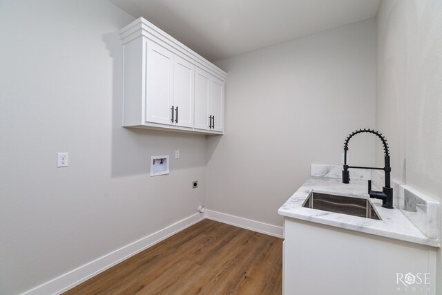 2734 Oak Hills Trl, San Angelo, TX 76904 - laundry room featuring cabinet space, dark wood-type flooring, baseboards, washer hookup, and hookup for an electric dryer