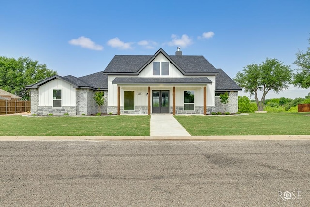 2734 Oak Hills Trl, San Angelo, TX 76904 - modern inspired farmhouse with french doors, board and batten siding, roof with shingles, a chimney, and stone siding