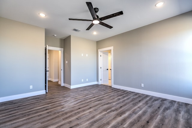 unfurnished bedroom with dark hardwood / wood-style flooring and ceiling fan