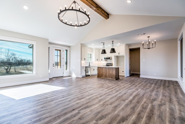 unfurnished living room featuring sink, an inviting chandelier, high vaulted ceiling, wood-type flooring, and beamed ceiling