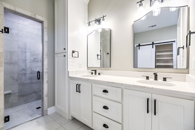 bathroom featuring walk in shower, tile patterned floors, and vanity