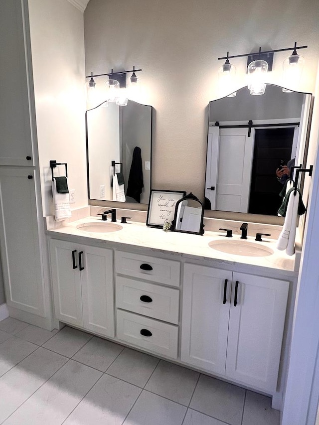 bathroom with tile patterned flooring and vanity