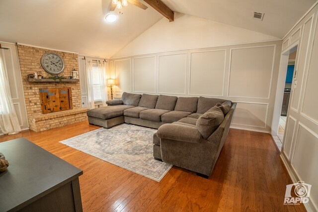 3709 Tridens Trl, San Angelo, TX 76904 - living area featuring a decorative wall, hardwood / wood-style flooring, and a ceiling fan