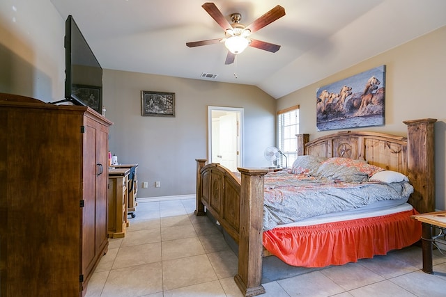 bedroom featuring lofted ceiling, light tile patterned floors, and ceiling fan