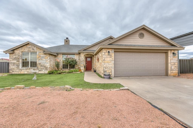 single story home featuring a garage and a front lawn