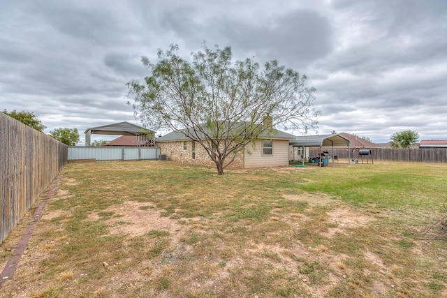 view of yard featuring a carport