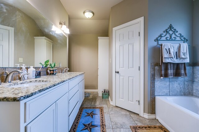 bathroom with vanity and a bathtub