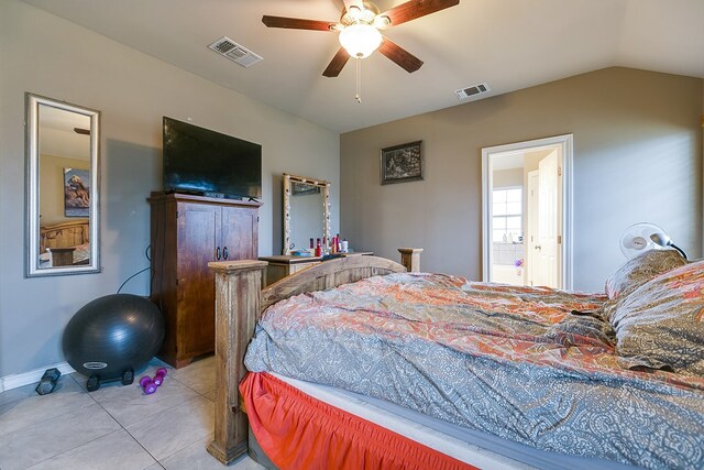 tiled bedroom featuring lofted ceiling and ceiling fan