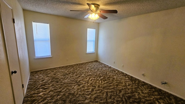 carpeted spare room with ceiling fan and a textured ceiling