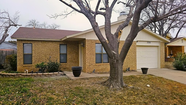 ranch-style house featuring a garage and a front yard