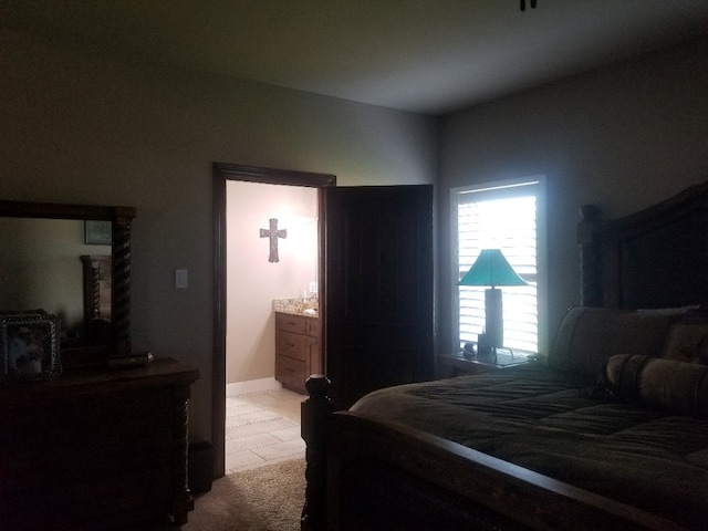 bedroom featuring light carpet