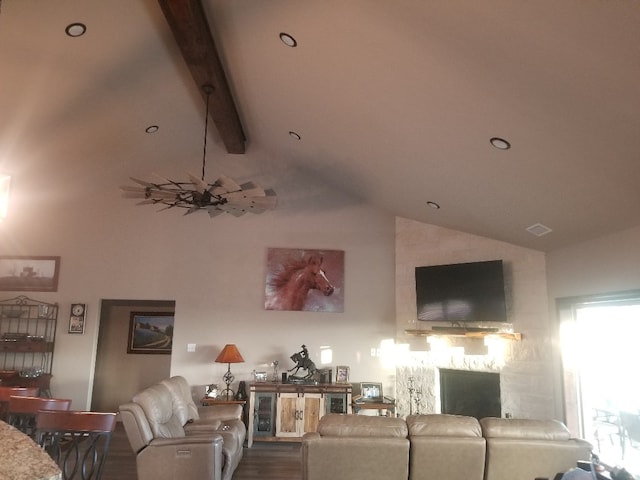 living room with lofted ceiling with beams