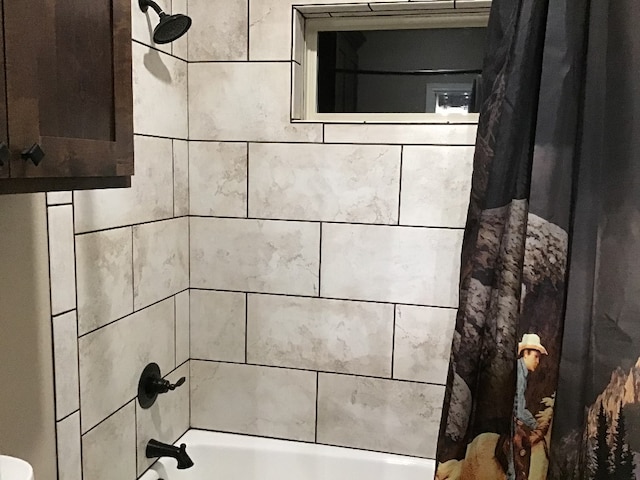 interior details featuring shower / bath combination with curtain