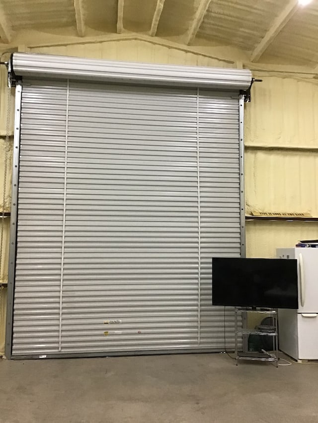 garage with white refrigerator