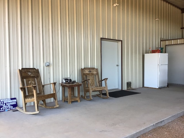 garage featuring white fridge