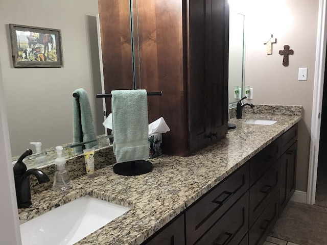 bathroom featuring tile patterned floors and vanity