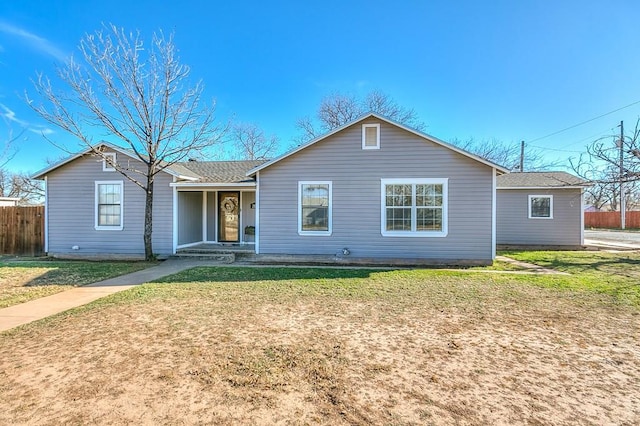 ranch-style home with a front lawn