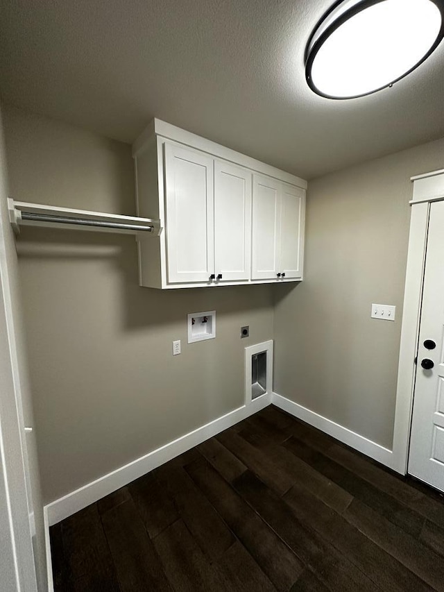 5610 Slayde St, San Angelo, TX 76904 - washroom with baseboards, dark wood finished floors, hookup for an electric dryer, washer hookup, and cabinet space