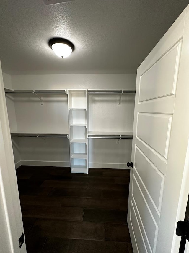 5610 Slayde St, San Angelo, TX 76904 - walk in closet with dark wood finished floors