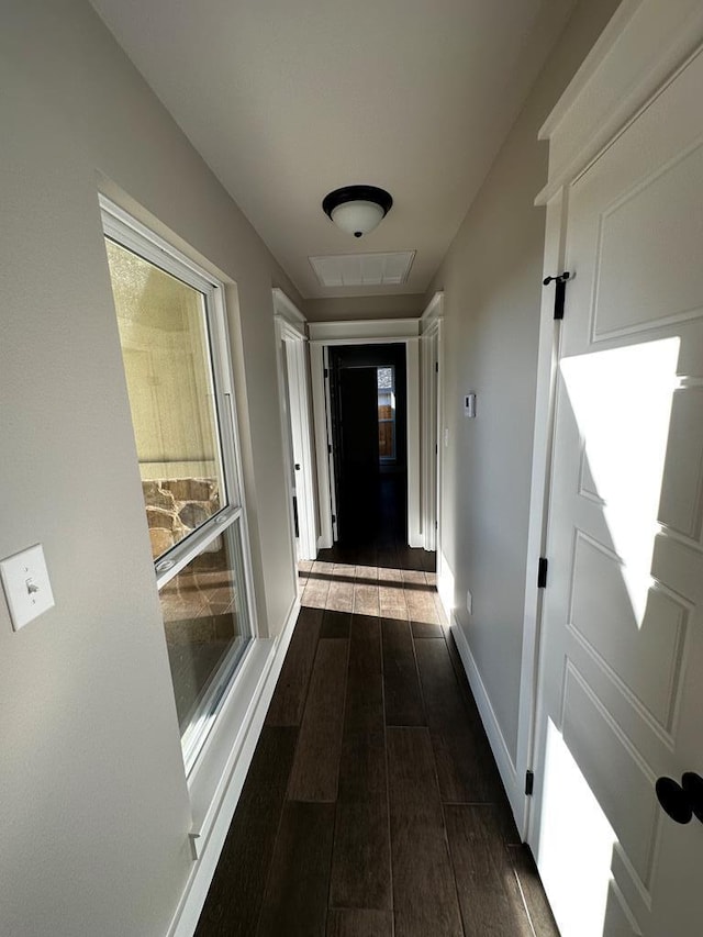 5610 Slayde St, San Angelo, TX 76904 - corridor featuring dark wood-style floors and baseboards