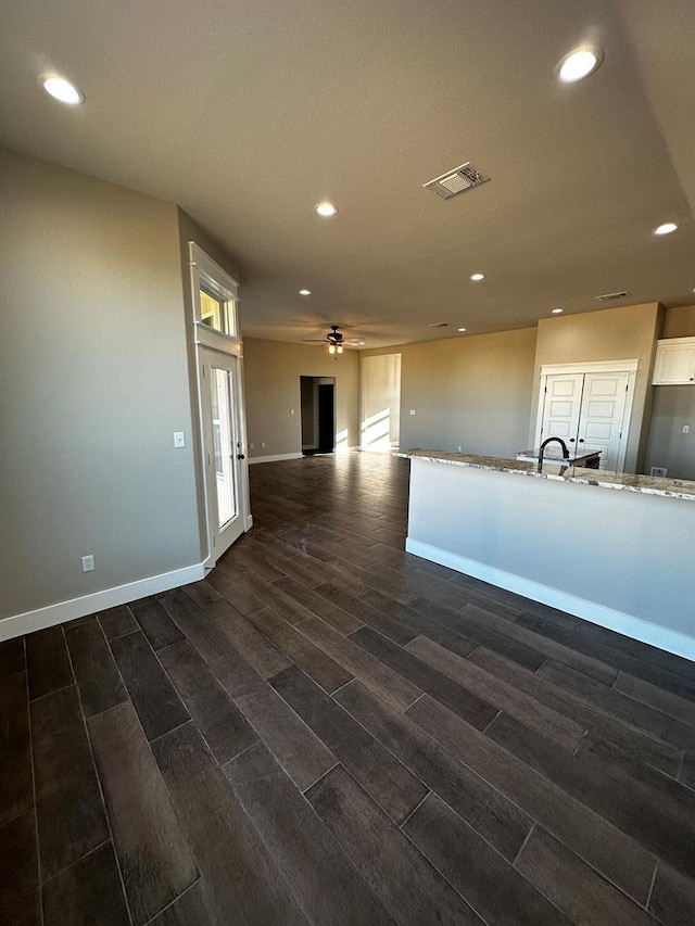 5610 Slayde St, San Angelo, TX 76904 - kitchen featuring ceiling fan, dark wood-type flooring, recessed lighting, baseboards, and open floor plan
