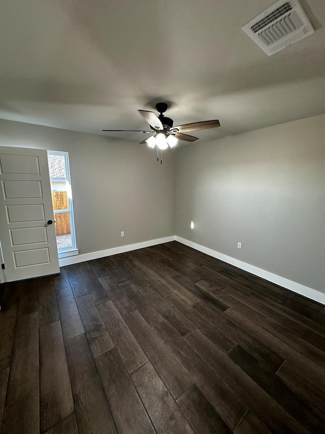 5610 Slayde St, San Angelo, TX 76904 - spare room with ceiling fan, baseboards, and dark wood finished floors
