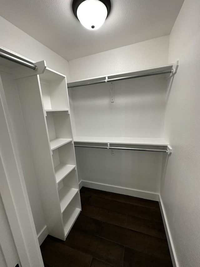 5610 Slayde St, San Angelo, TX 76904 - walk in closet with dark wood finished floors