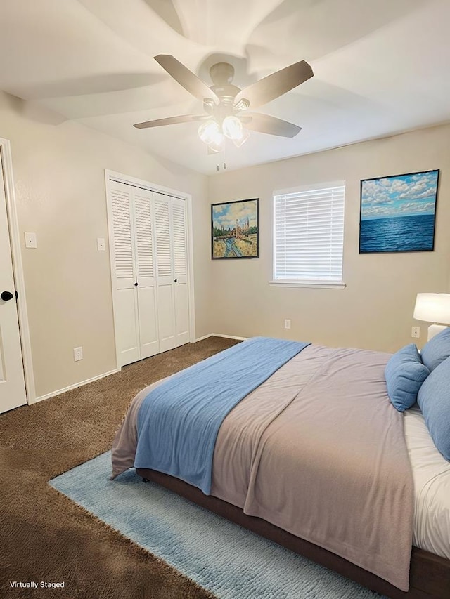 carpeted bedroom with a closet and ceiling fan