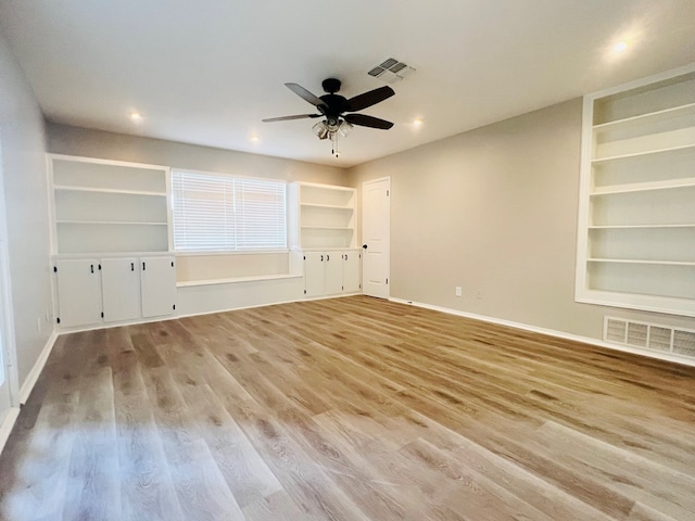 interior space featuring ceiling fan, light hardwood / wood-style floors, and built in features