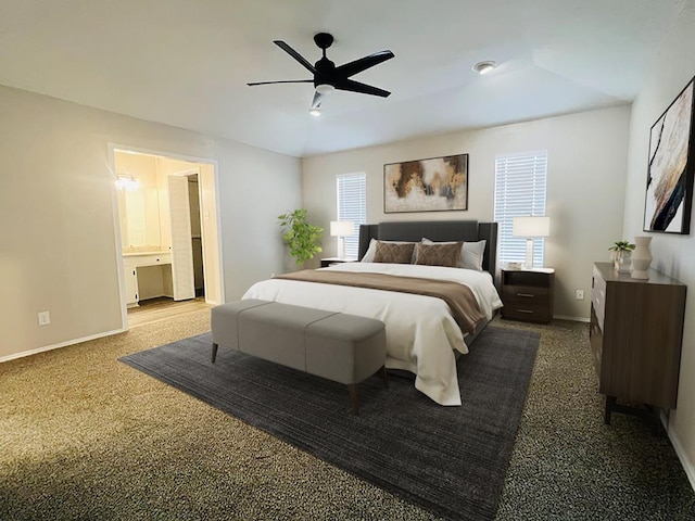 carpeted bedroom with ceiling fan and ensuite bath