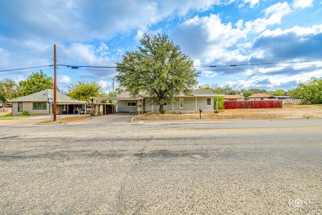 ranch-style home with a carport