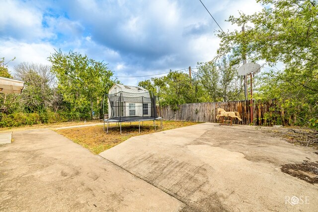 exterior space with a patio and a trampoline