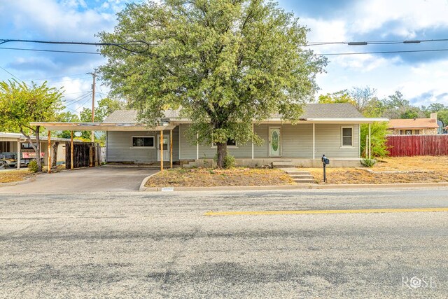 single story home featuring a carport