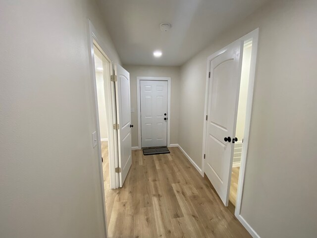 corridor featuring light wood-type flooring