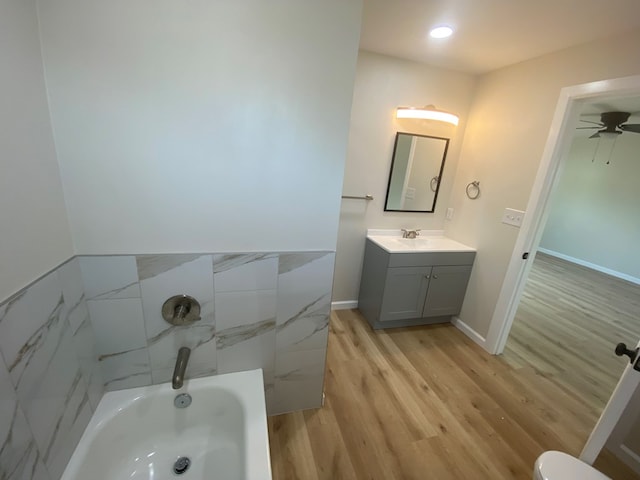 bathroom with vanity, wood-type flooring, and ceiling fan