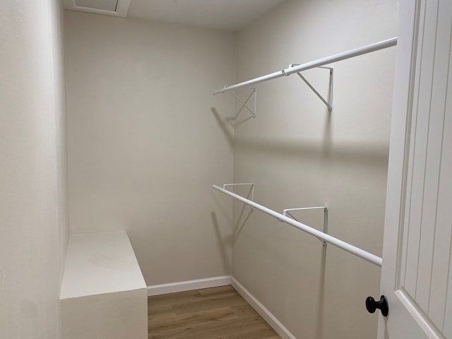 walk in closet featuring wood-type flooring