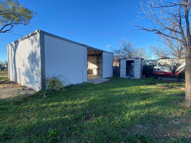 view of outdoor structure featuring a yard