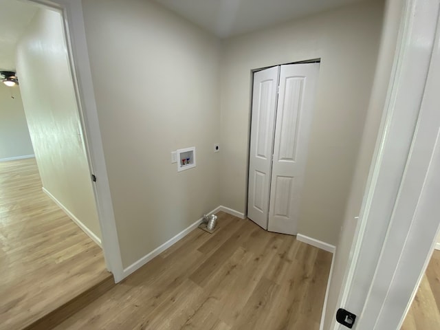 laundry room with washer hookup, hookup for an electric dryer, and light hardwood / wood-style flooring