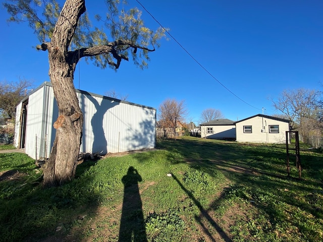 view of home's exterior with a yard