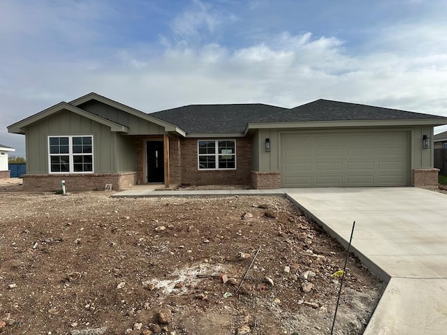 ranch-style house featuring a garage