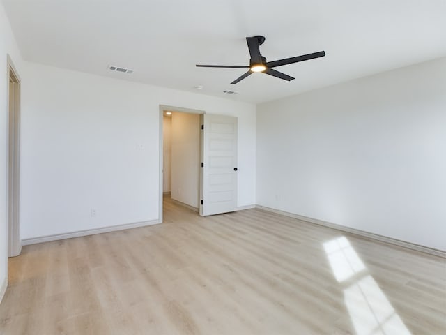 unfurnished room featuring ceiling fan and light wood-type flooring