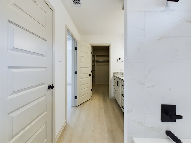 hallway featuring light wood-type flooring