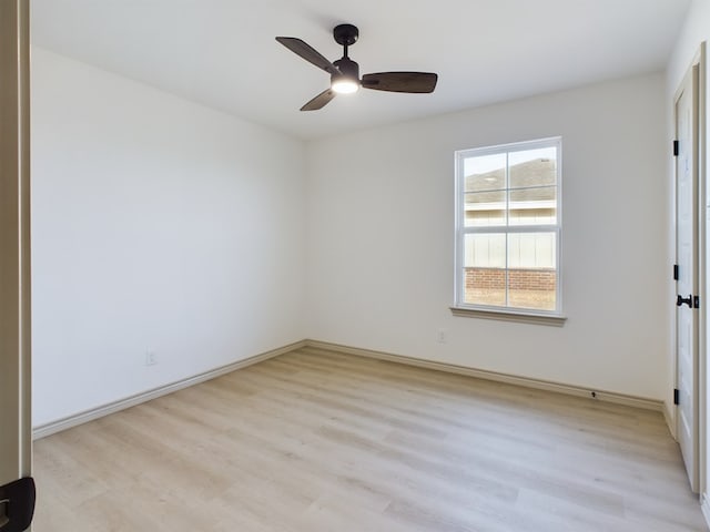 spare room featuring ceiling fan and light hardwood / wood-style flooring